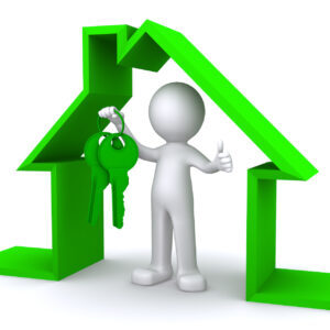 Concept image of a character holding a house key inside miniature house model on white background